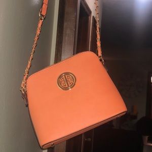 Orange satchel with gold details